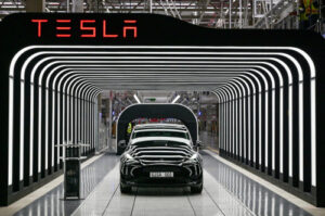 Tesla starts ‘first builds’ of affordable model, posts steepest drop in quarterly revenue in over a decade
