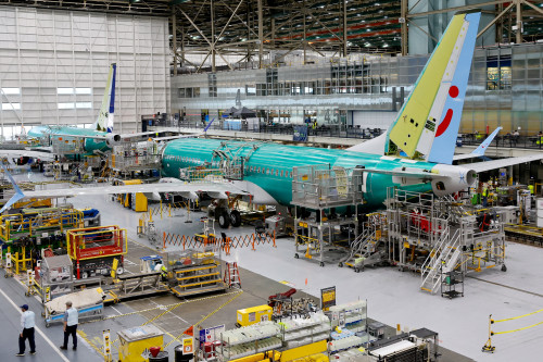 Boeing’s quarterly loss shrinks as jet deliveries rebound, but shares drop