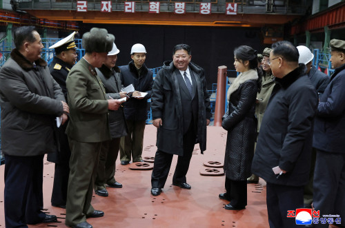 North Korea’s Kim Jong Un views submarine construction, oversees missile launch, KCNA says