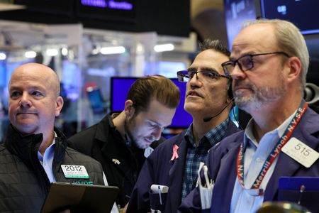 Wall Street ends up amid record low volatility ahead of eventful week