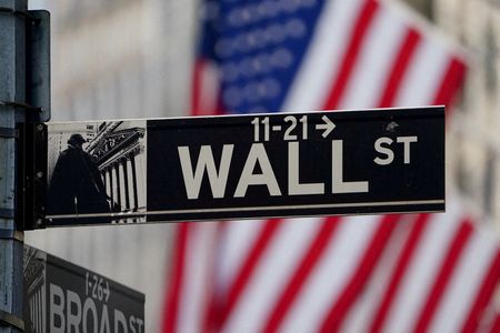 Wall Street ends lower, gold jumps as Fed minutes reveal cautious policy approach